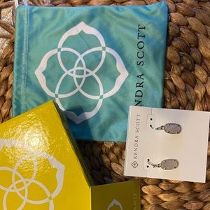 Kendra Scott Earrings gunmetal with blush gemstone.